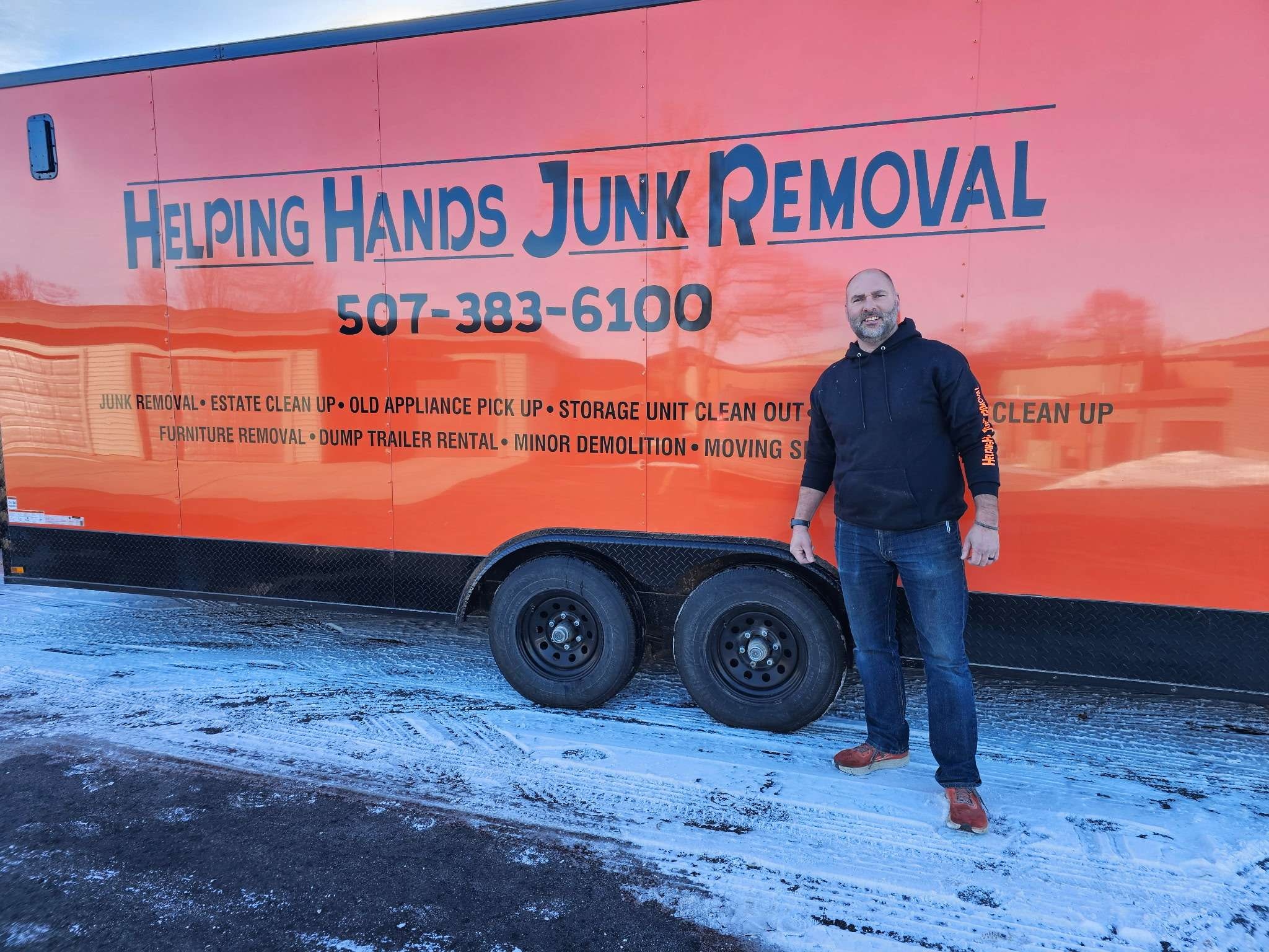 Helping Hands Junk Removal trailer and owner