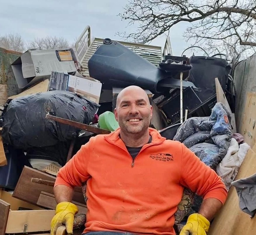 Helping Hands Junk Removal loaded cleanup trailer