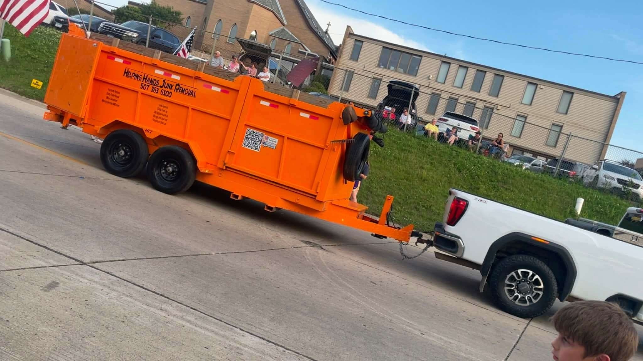 Helping Hands Junk Removal orange dump trailer